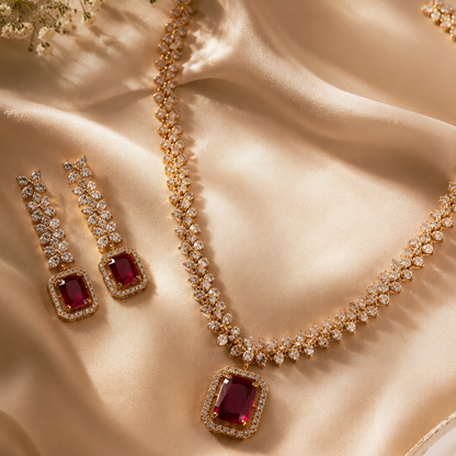 Jewelry set with necklace and earrings on a satin surface