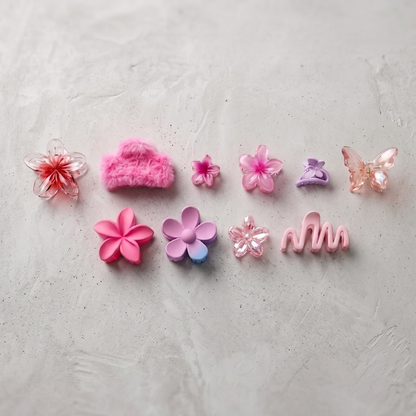 Set of colorful hair accessories on a light gray background