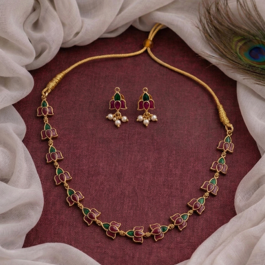 Jewelry set with necklace and earrings on a textured fabric background